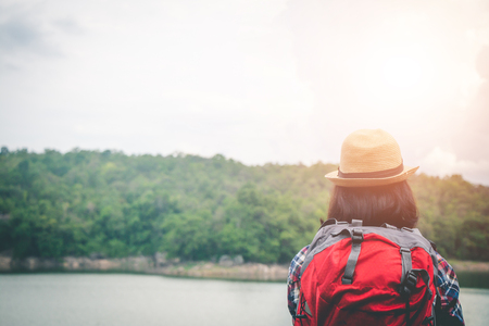 Female tourists in beautiful nature in tranquil scene, concept tourists backpack.の写真素材