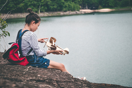 Female tourists in beautiful nature in tranquil scene, concept tourists backpack.の写真素材