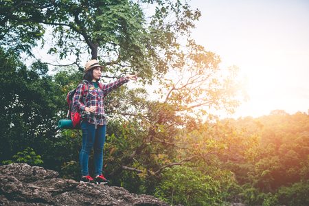 Female tourists in beautiful nature in tranquil scene, concept tourists backpack.の写真素材