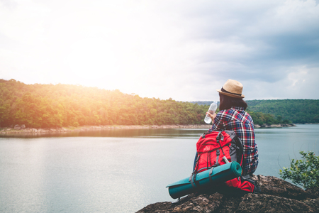 Female tourists in beautiful nature in tranquil scene, concept tourists backpack.の写真素材