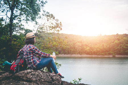 Female tourists in beautiful nature in tranquil scene, concept tourists backpack.の写真素材