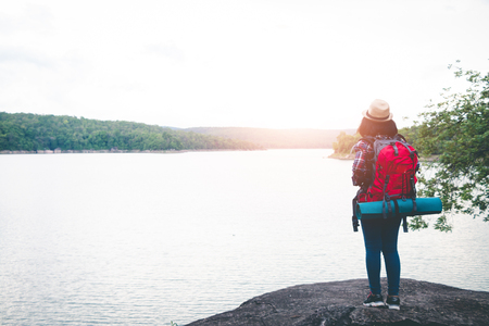 Female tourists in beautiful nature in tranquil scene, concept tourists backpack.の写真素材