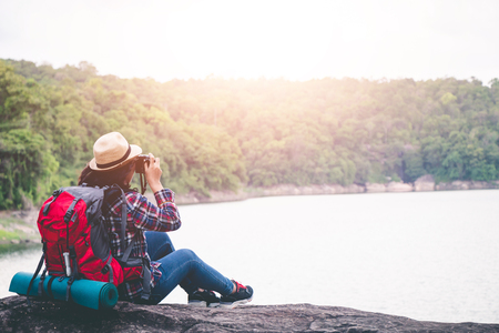 Female tourists in beautiful nature in tranquil scene, concept tourists backpack.の写真素材