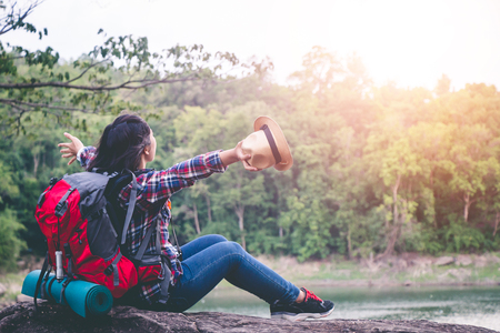 Female tourists in beautiful nature in tranquil scene, concept tourists backpack.の写真素材