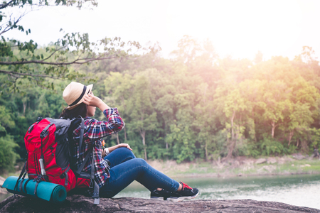Female tourists in beautiful nature in tranquil scene, concept tourists backpack.の写真素材