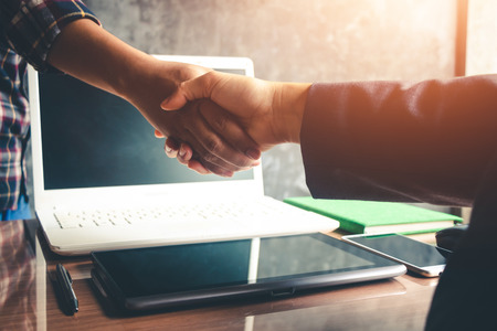 The hands of business people are willing to invest in business together in the office.の写真素材
