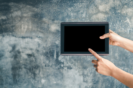 Presenting a presentation using a tablet in a presentation.の写真素材
