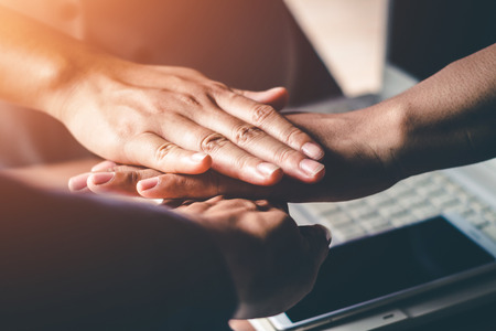 The hands of business people are willing to invest in business together in the office.の写真素材