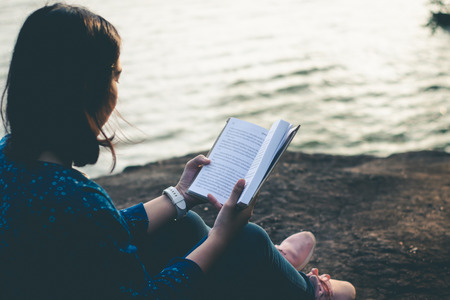 Women read books in quiet nature, concept read a books.の写真素材