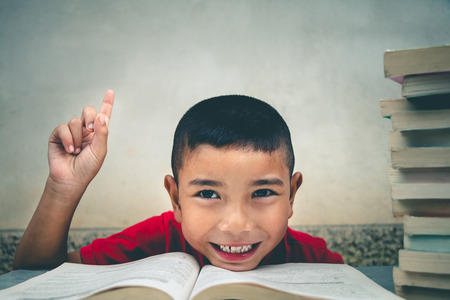 Boys are going to read books to gain more knowledge, concept read books.の写真素材