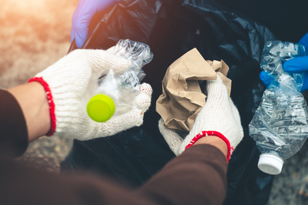 Group women volunteer help garbage collection charity environment.の写真素材