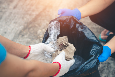 Group women volunteer help garbage collection charity environment.の写真素材
