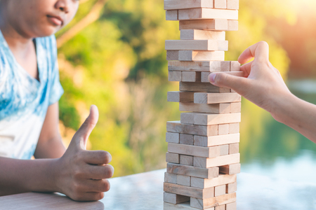 Children are playing stack high games to win the number one.の写真素材