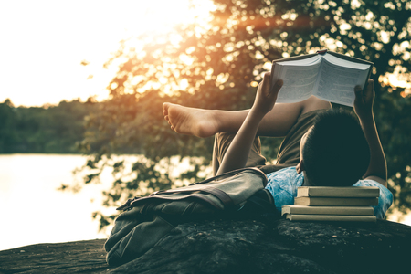 Men read books in quiet nature, concept read a books.の写真素材