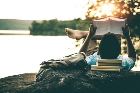 Men read books in quiet nature, concept read a books.の写真素材