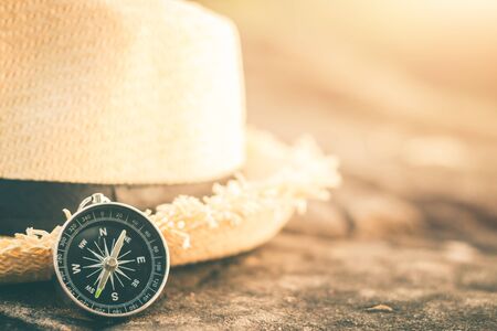 Travel compass on tourist hatの写真素材