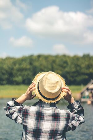 Female tourists in beautiful nature in tranquil scene of rivers and mountains.の写真素材