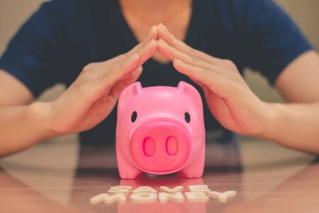 Save money in pig pink for future use, Concept saving money for the future.の写真素材