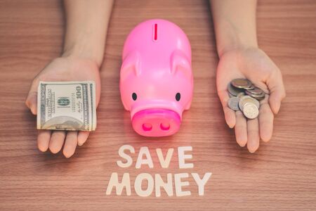 Save money in pig pink for future use, Concept saving money for the future.の写真素材
