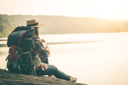 Female tourists in beautiful nature in tranquil scene, Tourists backpack go to nature.の写真素材