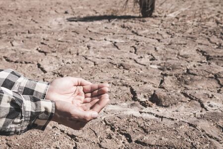 The ground cracks caused by drought caused by water shortages.の写真素材