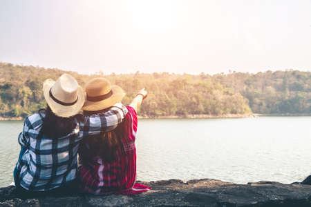 Women tourists in the midst of peaceful nature, Traveling of tourists only to find the beauty of nature.の写真素材