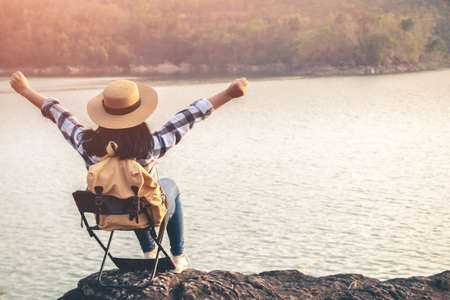 Women tourists in the midst of peaceful nature, Traveling of tourists only to find the beauty of nature.の写真素材