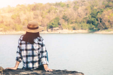 Women tourists in the midst of peaceful nature, Traveling of tourists only to find the beauty of nature.の写真素材