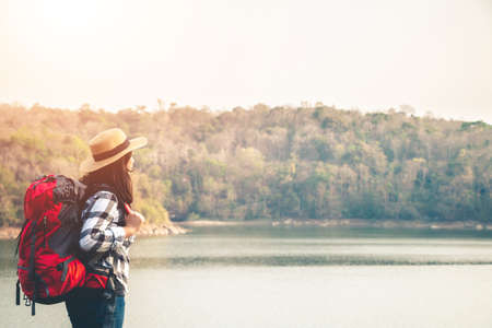 Women tourists in the midst of peaceful nature, Traveling of tourists only to find the beauty of nature.の写真素材