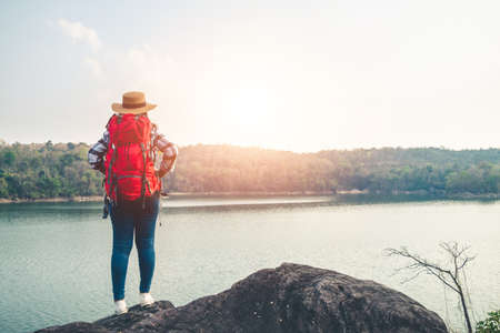 Women tourists in the midst of peaceful nature, Traveling of tourists only to find the beauty of nature.の写真素材