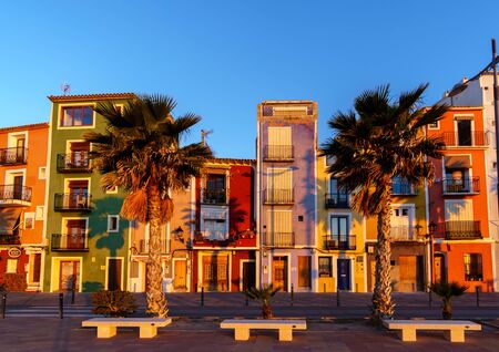 Villajoyosa -25 March 2017 - Typical coloured houses in Spanish Town during sunriseのeditorial素材