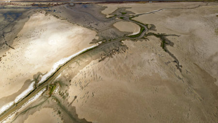 Aerial View of Salt Flats with Tidal Channel