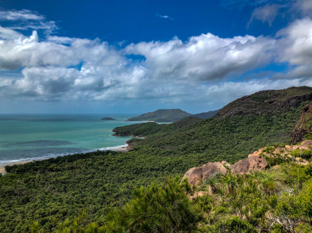 A Stunning Coastal Landscape Featuring Lush Greenery and Beautiful Blue Waters of Natureの写真素材