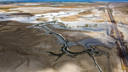 Aerial view of salt flats with tidal water inundationの写真素材