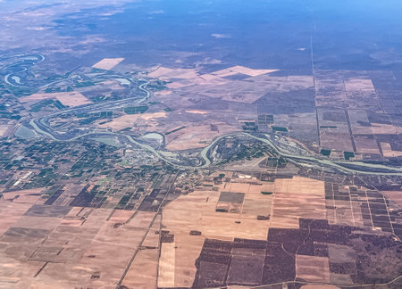 Aerial view of a town straddling a meandering river