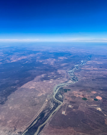 Aerial view of a town straddling a meandering riverの写真素材