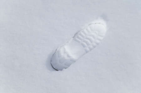 Footprint in fresh fallen snow, suitable for backgroundsの写真素材