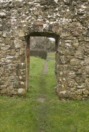 Doorway in an old stone wall of a derelict churchの写真素材