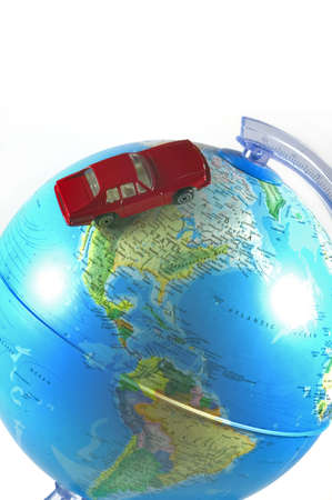 World globe with toy car driving across the USA, isolated on whiteの写真素材