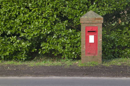 An English georgian mail box on the side of a village roadの写真素材