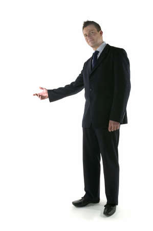 Businessman welcoming guests with an open gestureの写真素材