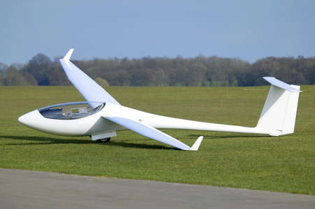 White Plane or Glider at rest on an airfieldの写真素材