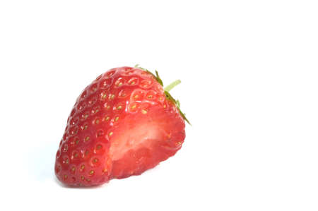 Juicy strawberry with a bite taken out of it, isolated on white