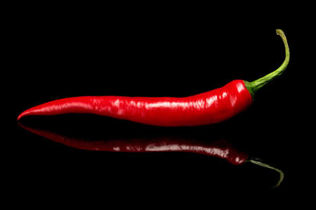 Red hot chilli pepper, isolated on black.
