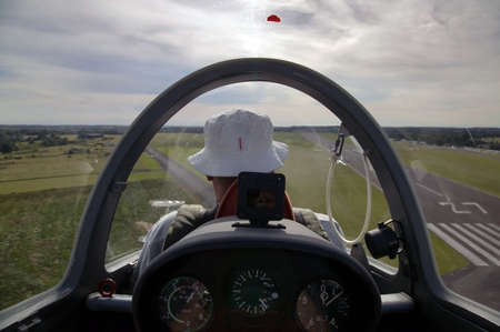 View from the cockpit of a glider about to land.