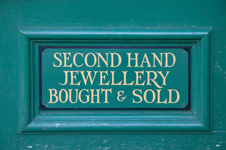 Old handpainted green 'second hand jewellery' sign.