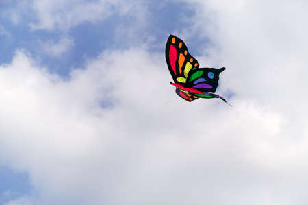 Butterfly kite flying in the sky.の写真素材