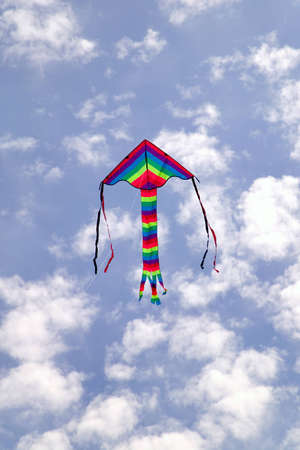 Colorful kite flying in the sky.の写真素材