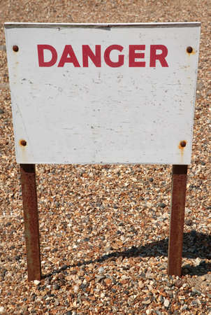 Old weathered sign with the word Danger, the rest is blank for your own text.の写真素材