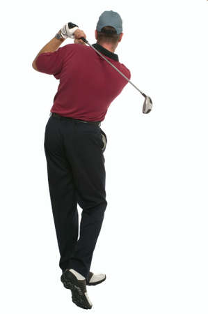 Rear view of a golfer during his back swing.の写真素材